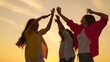 © Victoriia - Young women having fun in nature, relaxing in nature. People girls dancing to music at beach party raising hands up. Party, celebration, dancing, group of happy people raising hands to sky in evening.
