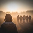 © Rio Ai - Group of people walking together towards a bright golden sunset horizon
