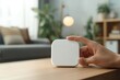 © Anna - Hand tuning wifi router with mockup sticker