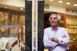 © .shock - Middle Eastern jewelry shop owner greets couple, friends and family shopping for wedding rings