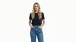 © Vasiliy - Young blonde woman in black t-shirt and blue jeans on white background. Casual fashion portrait of female model standing with hands in pockets. Minimalist studio shot for retail catalog