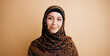 © DMegias - Woman wearing a vibrantly patterned headscarf and black underscarf, smiling calmly while looking at the viewer