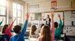 © Hossen - Elementary Students Raising Hands For A School Lesson