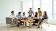 © Alicia - Group of people socializing in a modern living room
