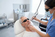 © Meow Creations - Mature man receiving advanced laser skin therapy treatment in a modern clinic
