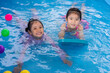 © geargodz - happy preschool child girl playing together with her sister in outdoor portable swimming pool in backyard