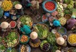 © Apel - A vibrant aerial view showcases a bustling Vietnamese market filled with colorful produce and vendors.