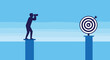 © The - Determined businessman stands on a high pillar while looking through binoculars at a target on another pillar across a wide blue gap.