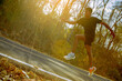 © Panumas - Silhouette of young man running sprinting on road. Fit runner fitness runner during outdoor workout with sunset background