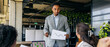 © Kostiantyn - Senior executive delivers compelling pitch with team support