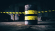 © timurlan999 - Rusty barrel with caution tape in abandoned industrial warehouse