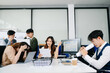 © Nuttapong punna - Stressed business team dealing with problem and deadline pressure in office meeting, showing conflict, frustration, and workplace challenges