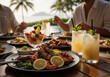 © Laxmico - Table scene of a luxurious seafood grill and cold drinks enjoyed at a tropical resort hotel