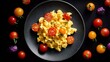 © fivan - Soft scrambled eggs with cherry tomatoes, colorful contrast, top view composition