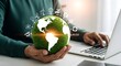 © Majethiya - Eco friendly business concept using laptop and earth globe for sustainable development goals