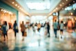 © adzimatul - Blurred background of people walking in a modern shopping mall.