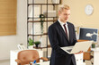 © Pixel-Shot - Young businessman working with laptop in office