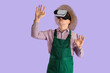 © Pixel-Shot - Male farmer using VR glasses on lilac background