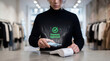 © Eduardo Accorinti - Man making contactless payment with smartphone on POS terminal with green approved transaction checkmark in retail clothing store