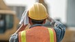 © 69 - Close-up View of Construction Worker Wiping Sweat with Towel Under Bright Sunlight