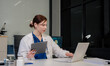 © NINENII - Medicine doctor hand working with modern digital tablet computer interface as medical network concept.