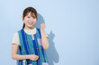 © kapinon - 保育士、家事代行、発達支援や療育などの子育て支援で働く若い女性の先生の仕事のイメージ　ガッツポーズで転職などのイメージに　カメラ目線の笑顔