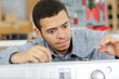 © auremar - a male electrician is repairing washing machine