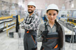 © Serhii - Portrait of two confident industrial workers in manufacturing plant