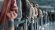 © dmmarychev - People standing in long queue behind barrier in public place