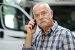 © auremar - senior lorry worker on the phone