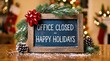 © Design Store - Festive holiday closure notice a charming wooden chalkboard announces an office is closed for happy holidays