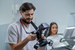 © zinkevych - Male doctor checking photo results and looking contented