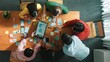 © InfiniteFlow - Top view of skilled software developer working together to develop Ux Ui design for mobile phone interface. Programmer sharing develop plan while looking at wireframe prototype icon. Convocation.