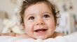 © Ohana - Cheerful Baby with Wide Eyes and Drooling Smile Close up Portrait