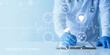 © KHAN VECTOR CO.  - Doctor wearing blue gloves and white lab coat uses a pen to write on a clipboard while medical icons and a heartbeat line hover around a stomach graphic representing probiotic therapy science