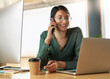 © peopleimages.com - Phone call, laptop and businesswoman in office with communication for finance report with client. Cellphone, computer and financial advisor on mobile discussion for investment project in workplace.