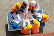 © NVB Stocker - Ethnic diversity worker people, Success teamwork. Group of professional engineering people wearing hardhat safety helmet meeting with solar photovoltaic panels discussion in new project