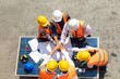 © NVB Stocker - Ethnic diversity worker people, Success teamwork. Group of professional engineering people wearing hardhat safety helmet meeting with solar photovoltaic panels discussion in new project