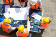 © NVB Stocker - Ethnic diversity worker people, Success teamwork. Group of professional engineering people wearing hardhat safety helmet meeting with solar photovoltaic panels discussion in new project