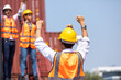 © NVB Stocker - Strike of workers in container yard. Group of multiethnic engineer people during a protest in workplace