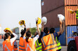 © NVB Stocker - Strike of workers in container yard. Group of multiethnic engineer people during a protest in workplace