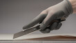 © Nadya - Precision Cutting with Utility Knife in Professional Work Environment