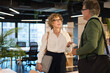 © Rido - Mature businesswoman talking to businessman