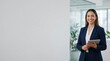 © BloomPix - Confident Businesswoman Holding Tablet in Modern Office