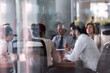 © .shock - Business meeting in a glass boardroom with colleagues collaborating on strategy and planning