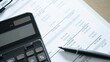 © Jokiewalker - Close up of calculator and pen on financial statement document, business accounting, budget analysis and corporate report concept.