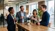 © Sanych - Happy businesspeople taking a coffee break at work, relaxed smiles, mugs in hand, modern office setting, friendly professional atmosphere, ultra-realistic, no logos.