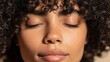 © Julia - The close-up captures a young woman's face, featuring healthy glowing skin and closed eyes