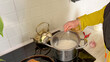 © Luiza - Muslim woman cooking rice on stove for festive meal saleeg