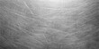 © NISAT AKTHER - A dark gray brushed metal texture background with a scratched vintage grunge pattern on a weathered old black surface material